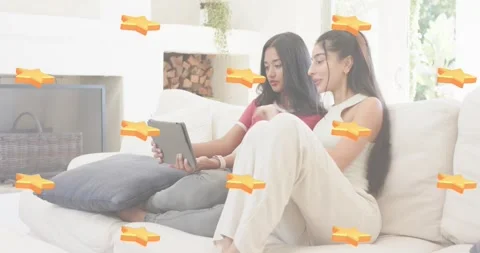 Two friends exploring tech demo, tapping tablet starting orange bars into Stock Footage 320126549