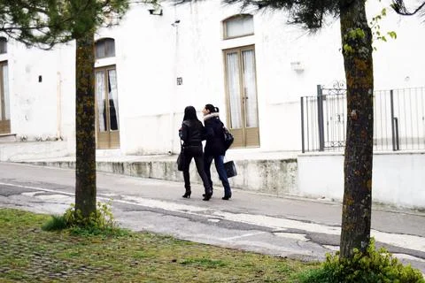 Two Friends Exploring the Uphill Path Together Stock Photos