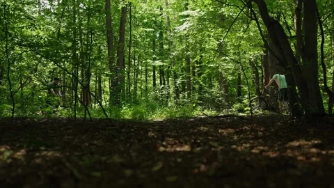 Two friends get rests after bicycle riding and weight loss training. Cyclists Stock Footage 293681204
