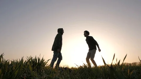 Two friends in green field Video stock 88414139