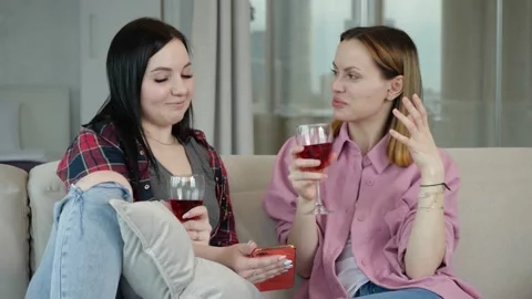 Two friends have fun talking, drinking wine and discussing work Video stock 153543266