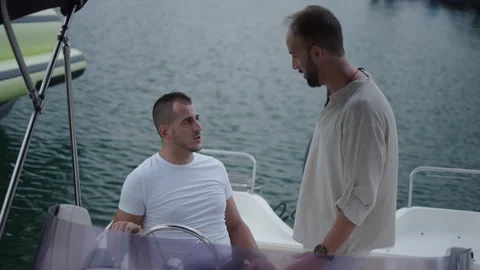 Two friends have a good time while they are on the boat Stock Footage 265907544