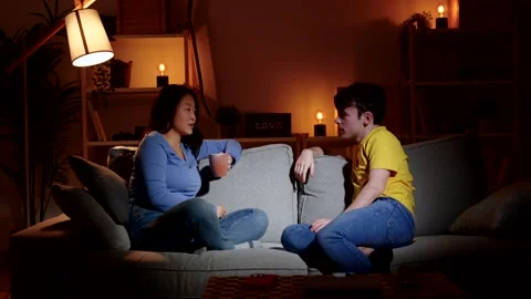 Two friends having conversation on sofa Stock Footage 264424065