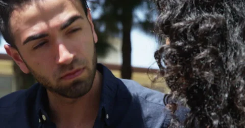 Two friends having a conversation together outdoors Stock Footage 51533394