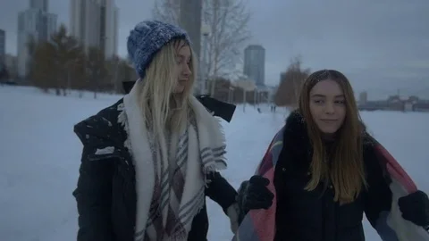 Two friends having fun in the snow in the winter 库存影片 71154552