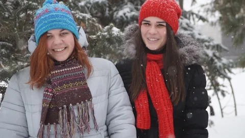 Two friends having fun in the winter park Stock Footage 71019743