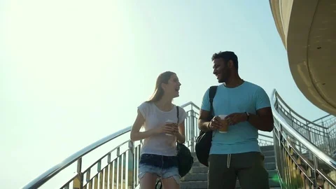 Two friends having pleasant conversation outdoors Stock Footage 79460158