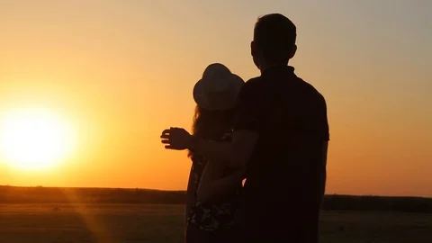 Two friends hold hands and back in circles on a beautiful summer day at sunset Stock Footage 89709204