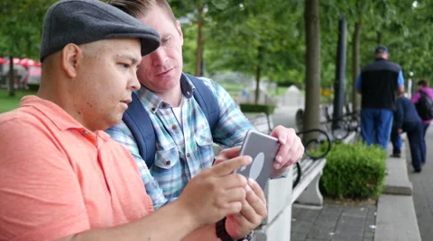 Two friends looking at tablet Stock-Footage 67353314