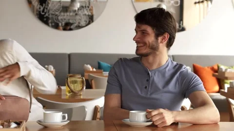 Two friends meet at the cafe Stock Footage 311984196