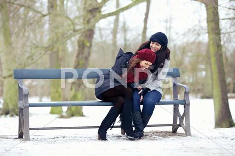 Two friends at the park sharing a good laugh Stock Photos