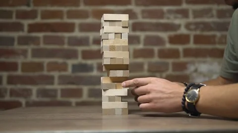 Two Friends Play Jenga Stock Footage
