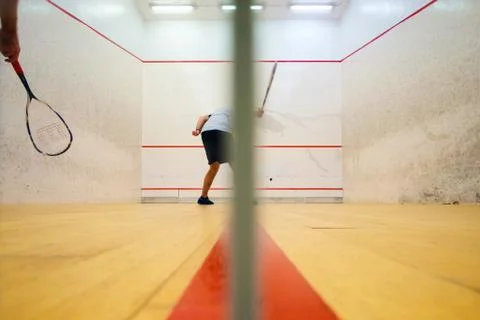 Two friends playing squash in Mutilva, Navarra, Spain Stock Photos