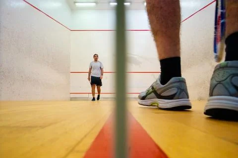 Two friends playing squash in Mutilva, Navarra, Spain Stock Photos