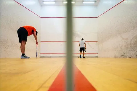 Two friends playing squash in Mutilva, Navarra, Spain Stock Photos