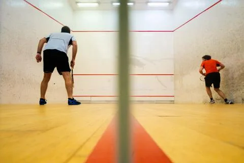 Two friends playing squash in Mutilva, Navarra, Spain Stock Photos