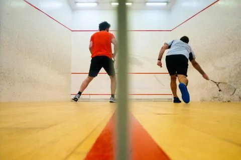 Two friends playing squash in Mutilva, Navarra, Spain Stock Photos