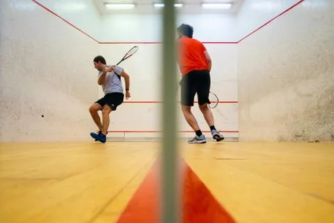 Two friends playing squash in Mutilva, Navarra, Spain Stock Photos
