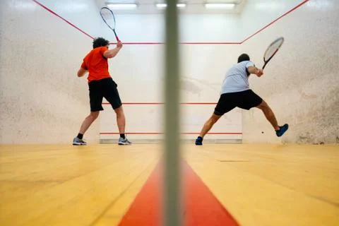 Two friends playing squash in Mutilva, Navarra, Spain Stock Photos