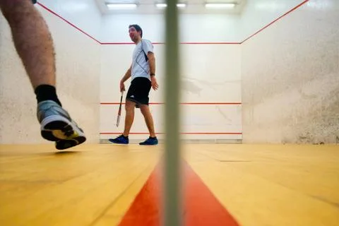 Two friends playing squash in Mutilva, Navarra, Spain Stock Photos