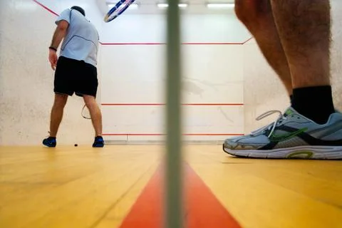 Two friends playing squash in Mutilva, Navarra, Spain Stock Photos