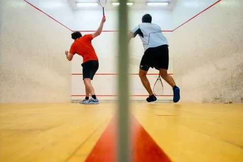 Two friends playing squash in Mutilva, Navarra, Spain Stock Photos
