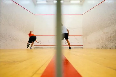 Two friends playing squash in Mutilva, Navarra, Spain Stock Photos