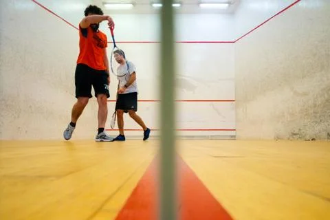 Two friends playing squash in Mutilva, Navarra, Spain Stock Photos