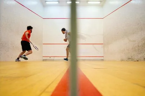 Two friends playing squash in Mutilva, Navarra, Spain Stock Photos