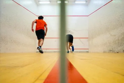 Two friends playing squash in Mutilva, Navarra, Spain Stock Photos