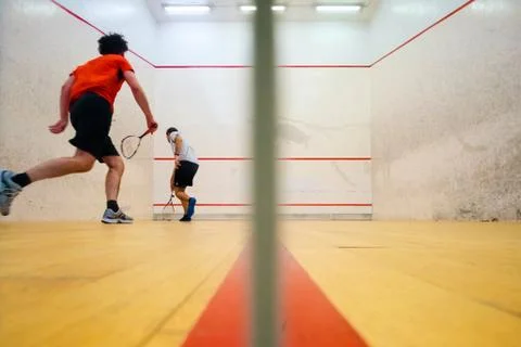 Two friends playing squash in Mutilva, Navarra, Spain Stock Photos