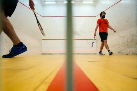 Two friends playing squash in Mutilva, Navarra, Spain Stock Photos
