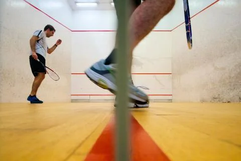 Two friends playing squash in Mutilva, Navarra, Spain Stock Photos