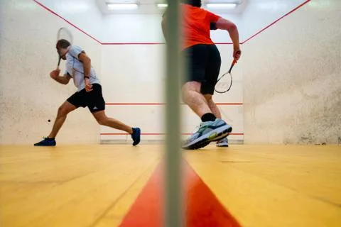 Two friends playing squash in Mutilva, Navarra, Spain Stock Photos