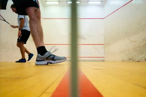 Two friends playing squash in Mutilva, Navarra, Spain Stock Photos