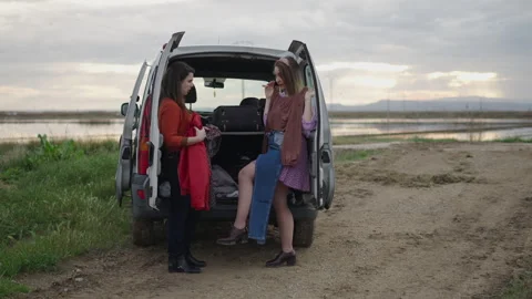 Two friends prepare their clothes for the photo shoot Stock Footage 280213638