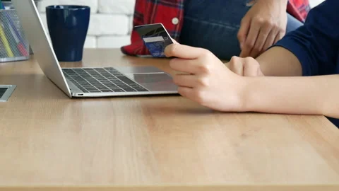 Two friends shopping using credit card online shopping on website laptop e-comme Video stock 158070351