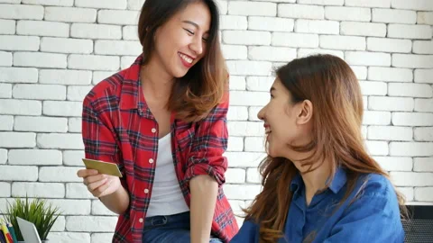 Two friends shopping using credit card online shopping on website laptop e-comme Stock-Footage 159865520
