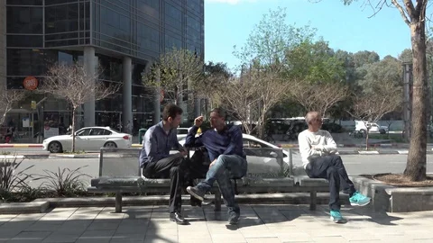Two friends sitting on a bench Stock Footage 103089824