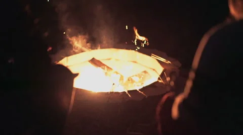 Two Friends Sitting by Fire Stock Footage 49354001