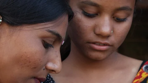 Two friends smiling at discovering something closeup on their pretty faces Stock Footage 92718187