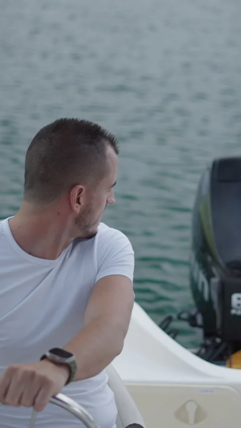 Two friends starting the boat engine in Spain Video stock 264924995