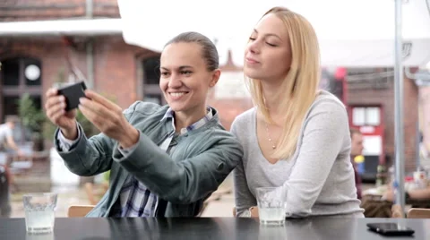 Two friends taking selfie in cafeteria. FULL HD. 動画素材 44932338