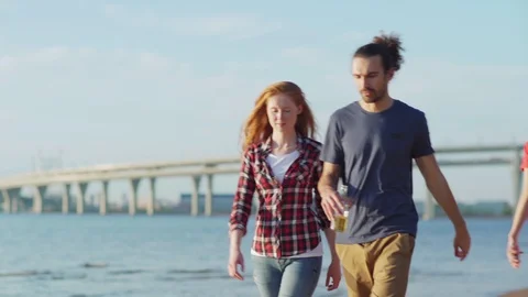 Two friends talking at beach walk Stock Footage 111592222