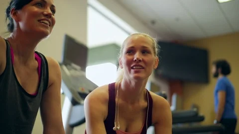 Two friends talking to each other while at the gym. Stock Footage 88404527