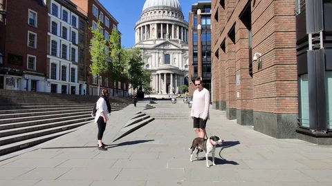 TWO FRIENDS TALKING TO EACH OTHER WHILE SOCIAL DISTANCING, LONDON, 4K Stock Footage 129092265