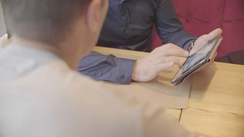 Two friends talking over their new startup project using tablet Stock Footage 72619910