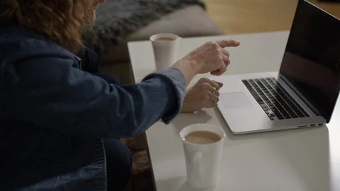 Two friends using laptop computer over coffee Stock Footage 88604855