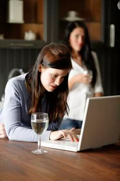 Two friends using laptop Stock Photos