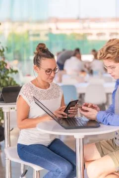 Two friends using on phone Stock Photos